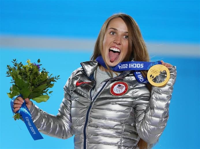 Maddie Bowman with an American flag after the Sochi 2014 ski halfpipe